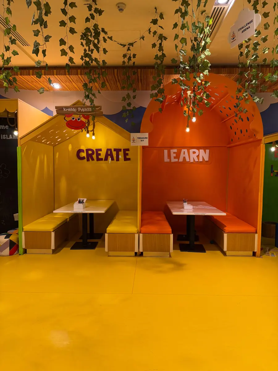 The CREATE and LEARN craft booths with bench seating