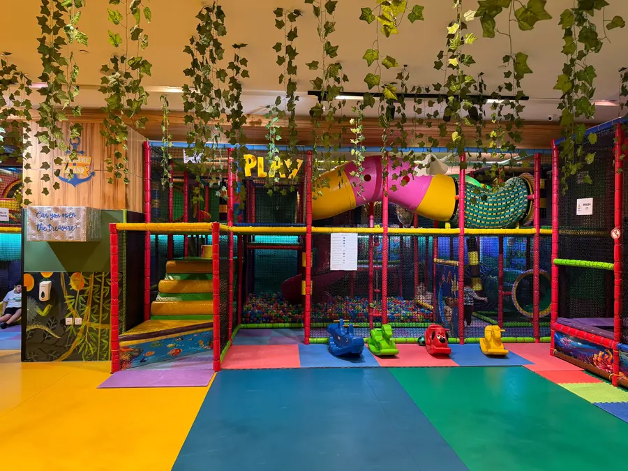 The multi-level soft play fort with slides, nets and tunnels